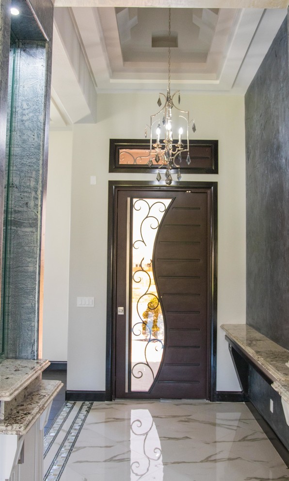 Inspiration for a small transitional marble floor and white floor foyer remodel with gray walls and a dark wood front door