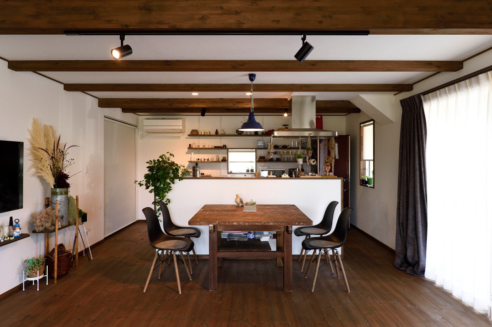 Design ideas for an industrial open plan dining in Other with white walls, dark hardwood floors and brown floor.