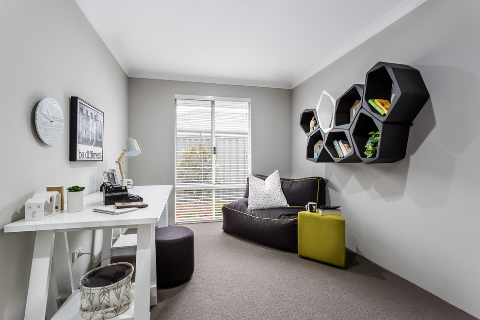 Photo of a mid-sized contemporary study room in Perth with grey walls, carpet, a freestanding desk and grey floor.