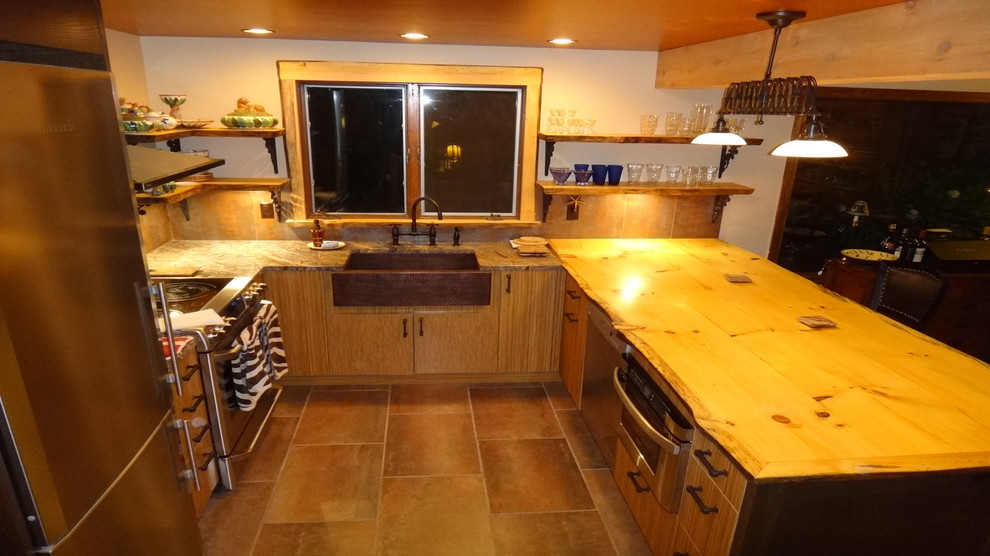 Example of a mid-sized mountain style kitchen design with medium tone wood cabinets, wood countertops, metallic backsplash and an island