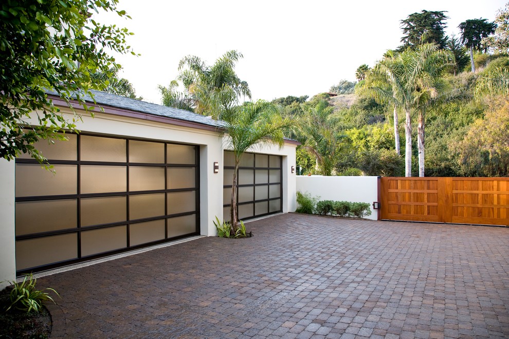 Photo of a large tropical attached two-car garage in Santa Barbara.
