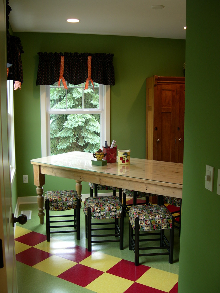 This is an example of a country gender-neutral kids' playroom in Grand Rapids with green walls, vinyl floors and multi-coloured floor.