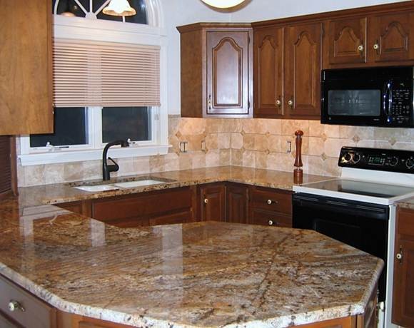Photo of a small contemporary u-shaped separate kitchen in Providence with an undermount sink, granite benchtops, black appliances and with island.