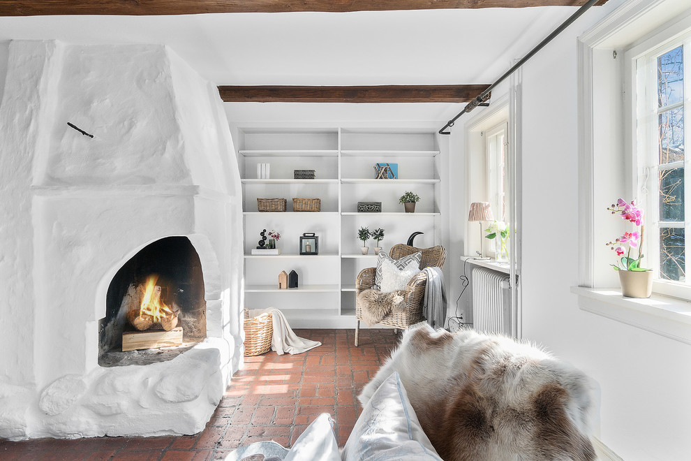 Inspiration for a country living room in Copenhagen with white walls and brown floor.