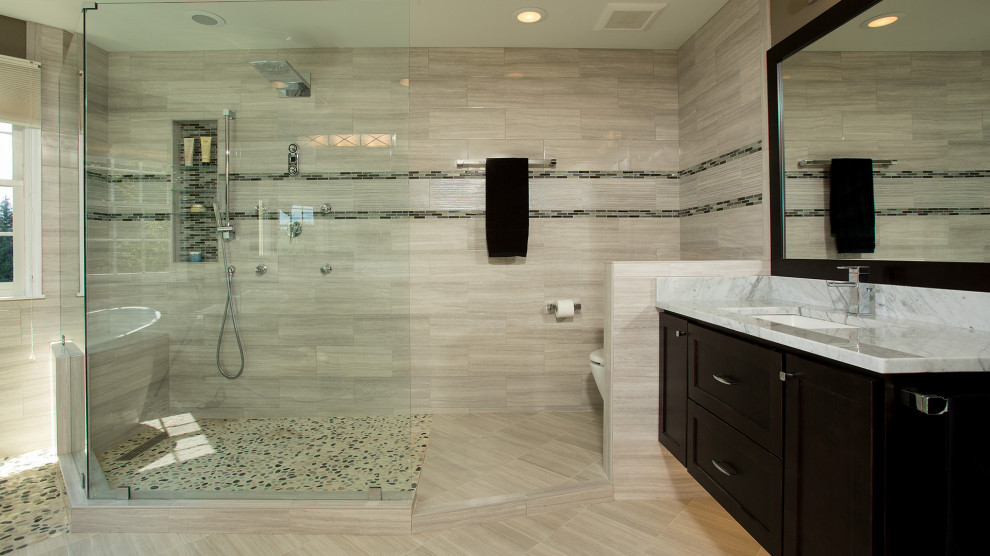 Design ideas for a mid-sized modern master bathroom in Boston with recessed-panel cabinets, brown cabinets, a freestanding tub, an open shower, a one-piece toilet, brown tile, porcelain tile, brown walls, ceramic floors, a drop-in sink, marble benchtops, brown floor, an open shower, yellow benchtops, a single vanity and a floating vanity.