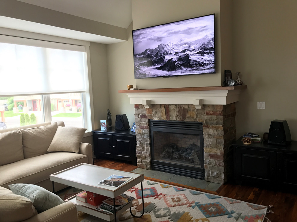 This is an example of a traditional living room in Other with a music area, a standard fireplace and a stone fireplace surround.