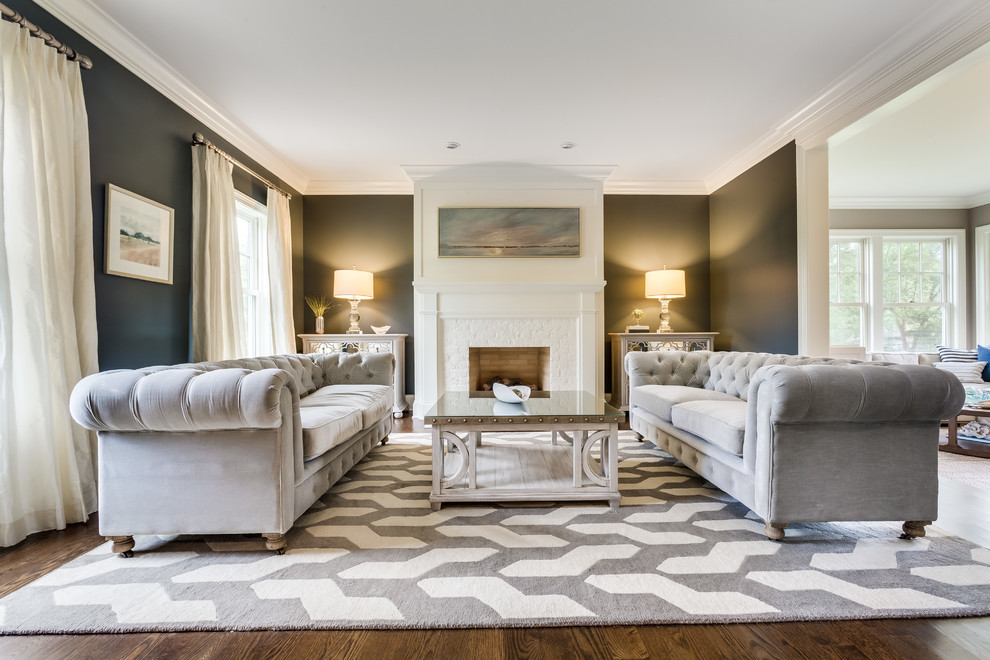Photo of a large transitional formal enclosed living room in Chicago with grey walls, dark hardwood floors, a standard fireplace, a brick fireplace surround, no tv and brown floor.