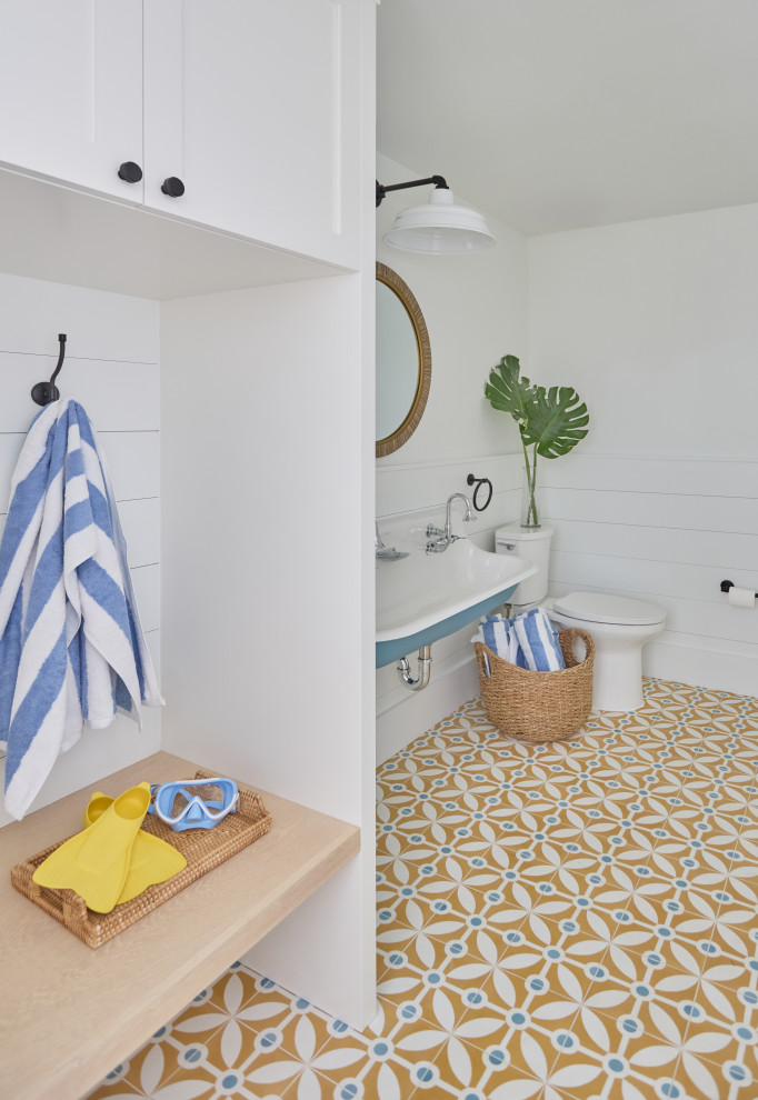 2 Chicks Happy Family Home - Pool Bathroom with Built-In Bench and Patterned Tile Floor
Description: A family-ready pool bath in a Ponte Vedra Beach custom home by 2 Chicks Design Co. A built-in white bench with hooks for towels and beach gear, and a patterned cement tile floor create a hardworking drop zone designed for daily Florida life.
Tags: Pool Bath, Built-In Bench, Cement Tile, Coastal Pool Bath, Yellow and Blue