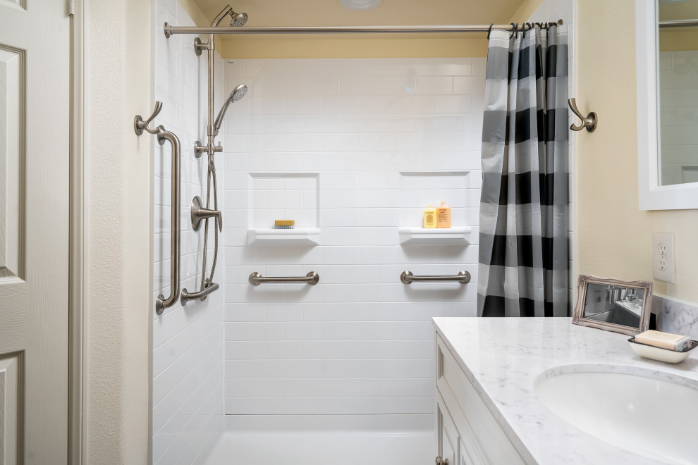 Inspiration for a mid-sized transitional master bathroom in Los Angeles with raised-panel cabinets, white cabinets, a curbless shower, a two-piece toilet, beige walls, vinyl floors, an undermount sink, engineered quartz benchtops, brown floor, white benchtops and a shower curtain.