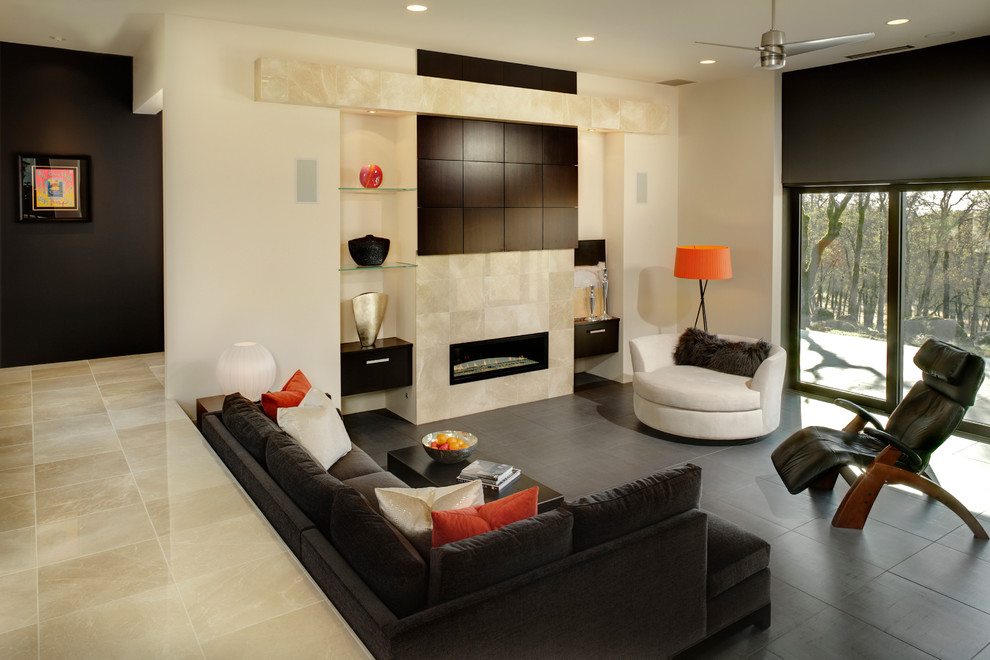This is an example of a large contemporary open concept living room in Sacramento with a tile fireplace surround, beige walls, porcelain floors, a ribbon fireplace, a concealed tv and grey floor.