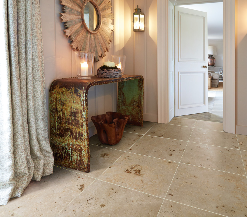 This is an example of a contemporary hallway in Other with limestone floors.