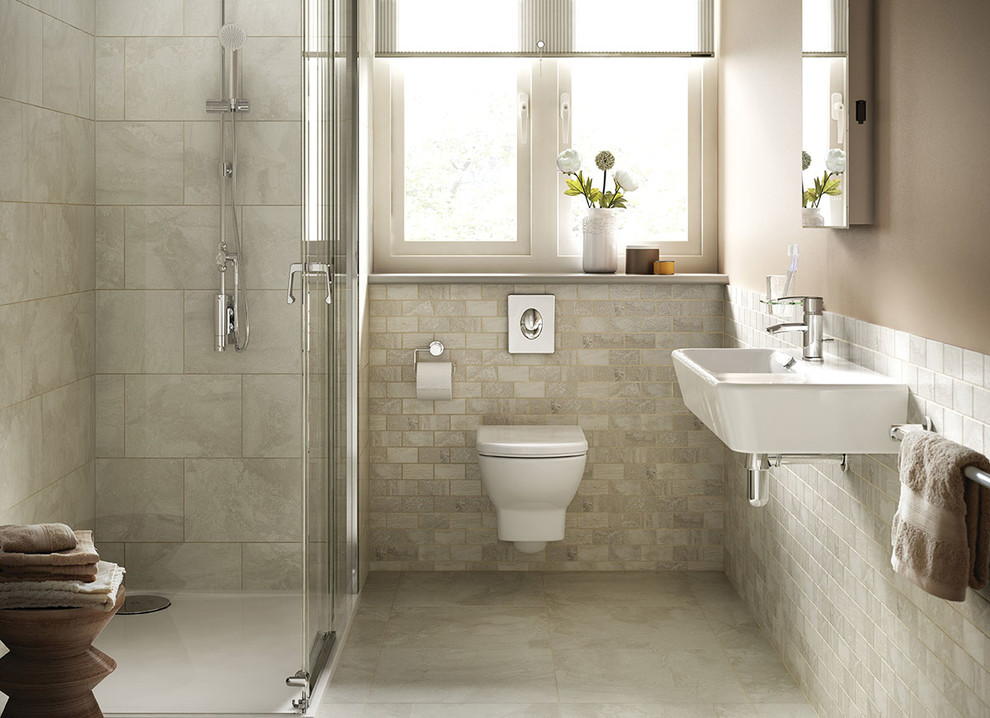 Design ideas for a mid-sized contemporary 3/4 bathroom in DC Metro with a corner shower, a wall-mount toilet, beige tile, beige walls, a wall-mount sink, beige floor, a hinged shower door and stone tile.