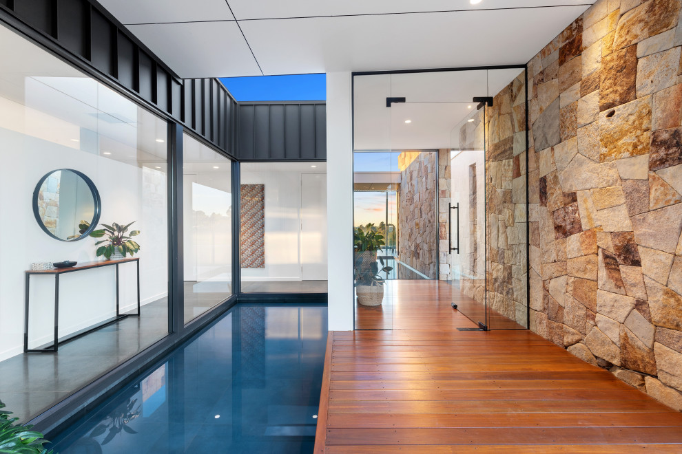 Design ideas for a contemporary front door in Brisbane with a single front door and a glass front door.