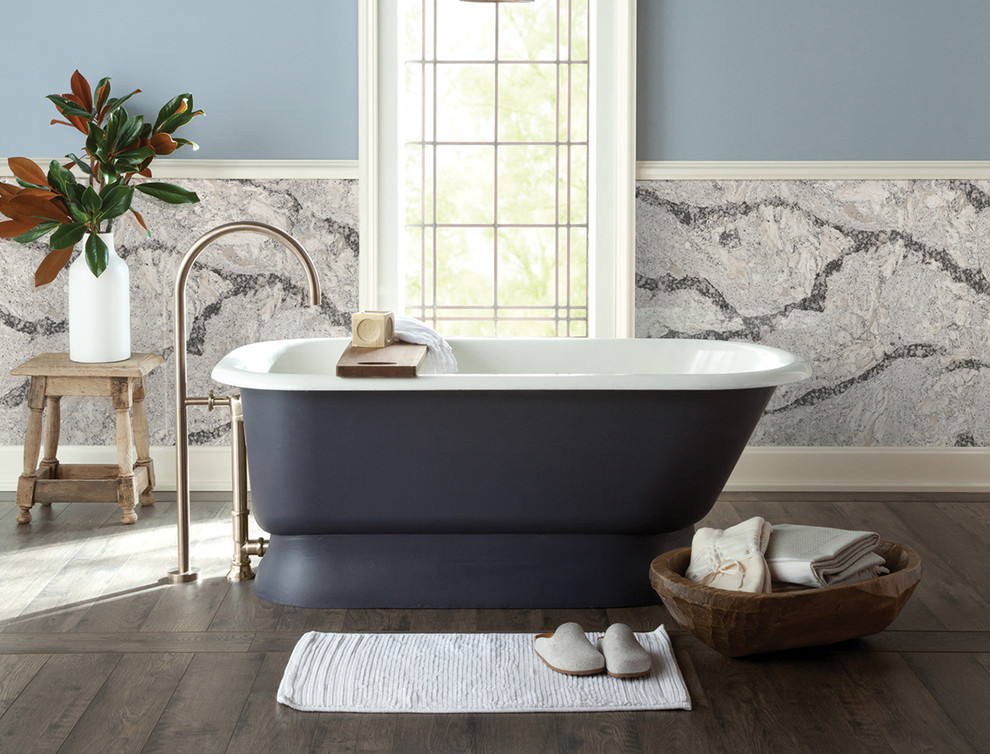 Design ideas for an expansive transitional master bathroom in New York with a freestanding tub, stone slab, blue walls, dark hardwood floors and brown floor.
