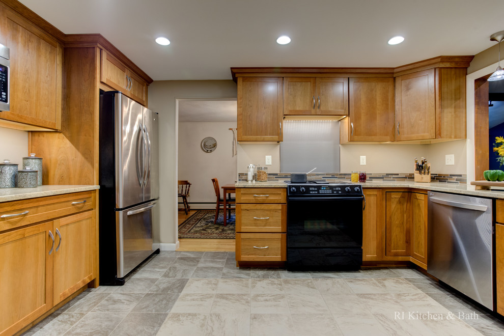 Mid-sized transitional u-shaped porcelain tile enclosed kitchen photo in Providence with an undermount sink, shaker cabinets, medium tone wood cabinets, granite countertops, multicolored backsplash, glass tile backsplash, stainless steel appliances and no island