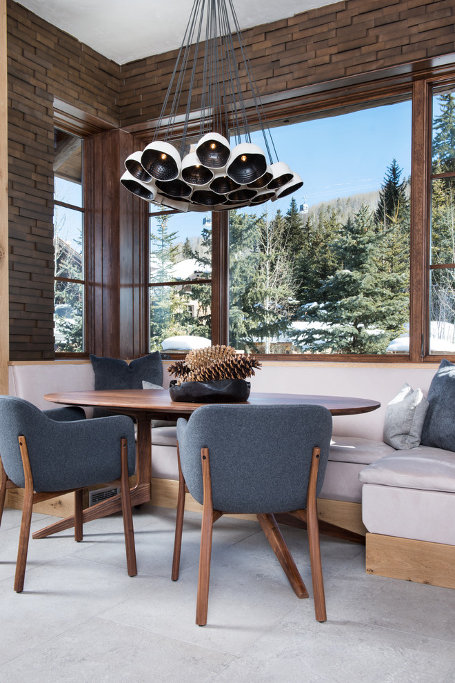 Vail Ski Haus - Dining room - small rustic carpeted and gray floor dining room idea in Denver with brown walls and no fireplace