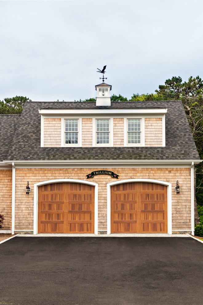 Example of a beach style two-car garage design in Boston