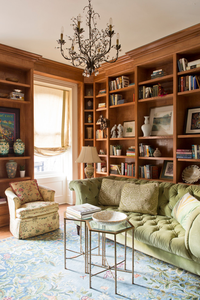 Photo of a traditional living room in New York with a library.