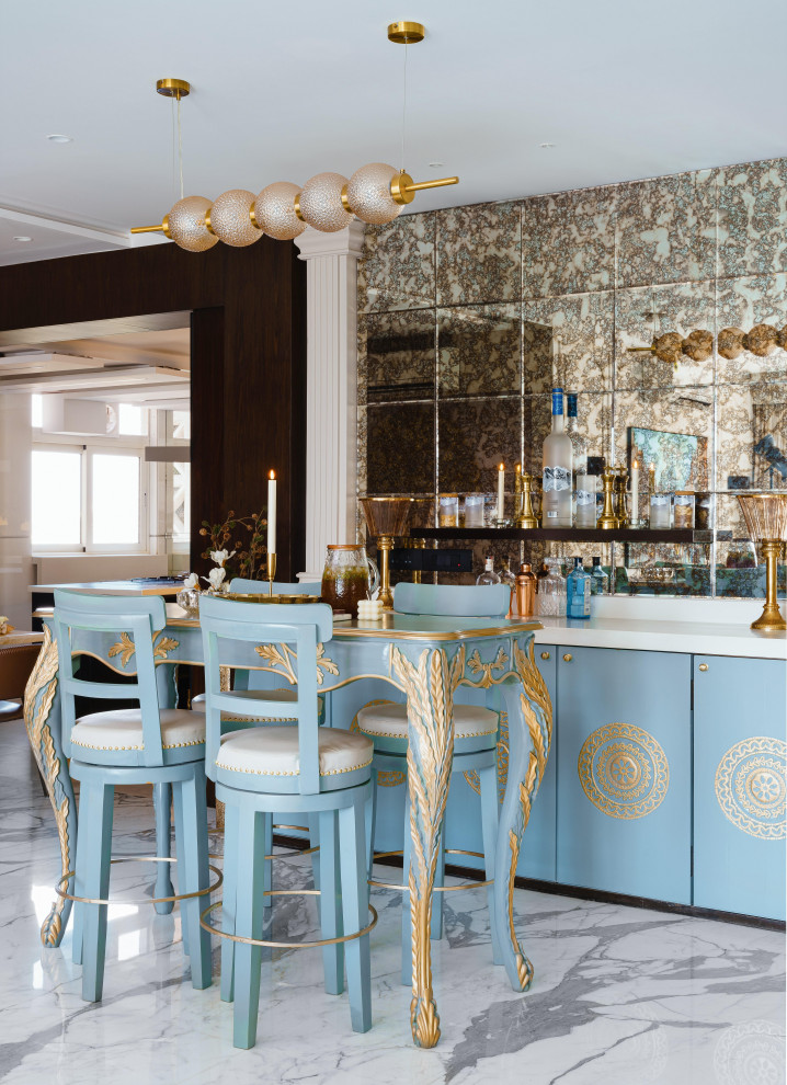 Large midcentury single-wall seated home bar in Mumbai with no sink, blue cabinets, solid surface benchtops, black splashback, mirror splashback, marble floors, white floor, white benchtop and raised-panel cabinets.