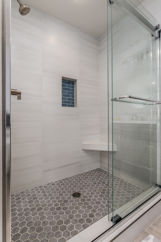 This is an example of a medium sized classic ensuite bathroom in San Diego with recessed-panel cabinets, dark wood cabinets, an alcove shower, beige tiles, porcelain tiles, beige walls, porcelain flooring, a submerged sink, engineered stone worktops, beige floors, a sliding door, white worktops, a shower bench, double sinks and a built in vanity unit.