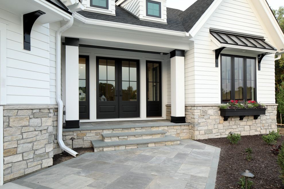 Design ideas for a front yard garden in Minneapolis with with path and natural stone pavers.