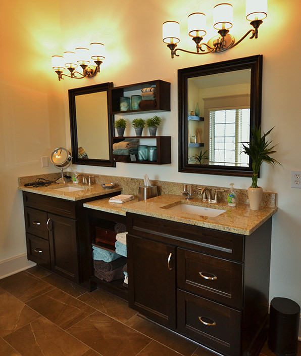 Large transitional master beige tile home design photo in Columbus with an undermount sink, recessed-panel cabinets, dark wood cabinets, granite countertops and yellow walls