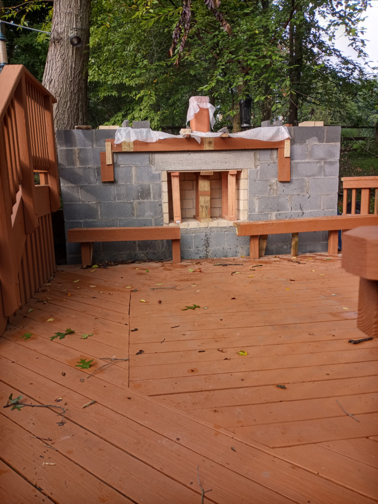 STONE FIREPLACE  , BBQ GRILL   AND STONE RETAINING WALL