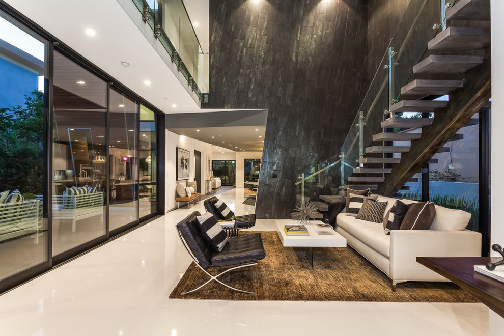 Contemporary formal living room in Los Angeles with black walls.