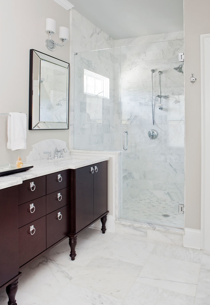 Inspiration for a transitional bathroom in Atlanta with an undermount sink, dark wood cabinets, marble benchtops, an alcove shower, white tile, stone slab, marble floors and flat-panel cabinets.