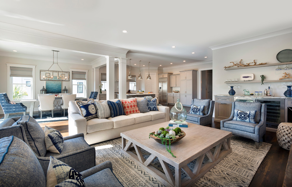 Inspiration for a beach style open concept living room in Charleston with white walls, dark hardwood floors and brown floor.