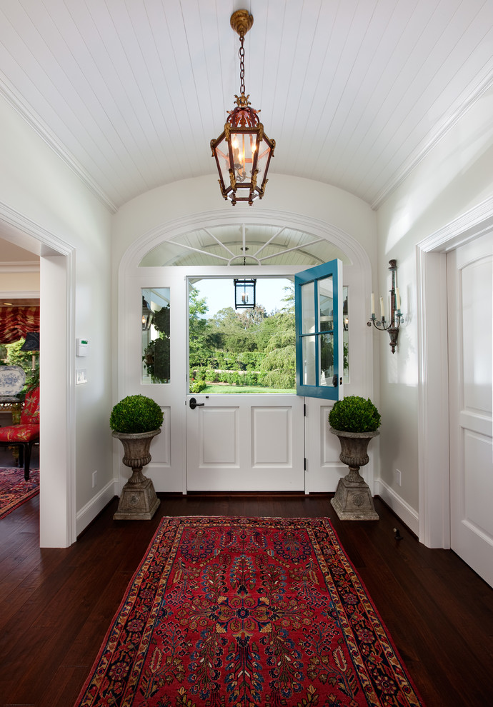 Photo of a traditional foyer in Santa Barbara with a dutch front door.