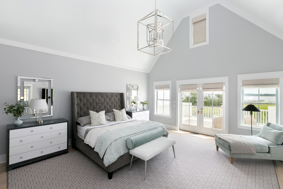 Transitional bedroom in Charleston with grey walls, light hardwood floors and beige floor.