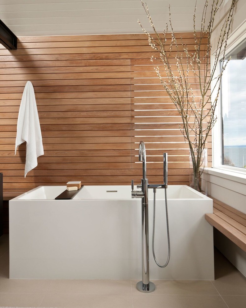 Contemporary master bathroom in San Francisco with a freestanding tub and beige floor.