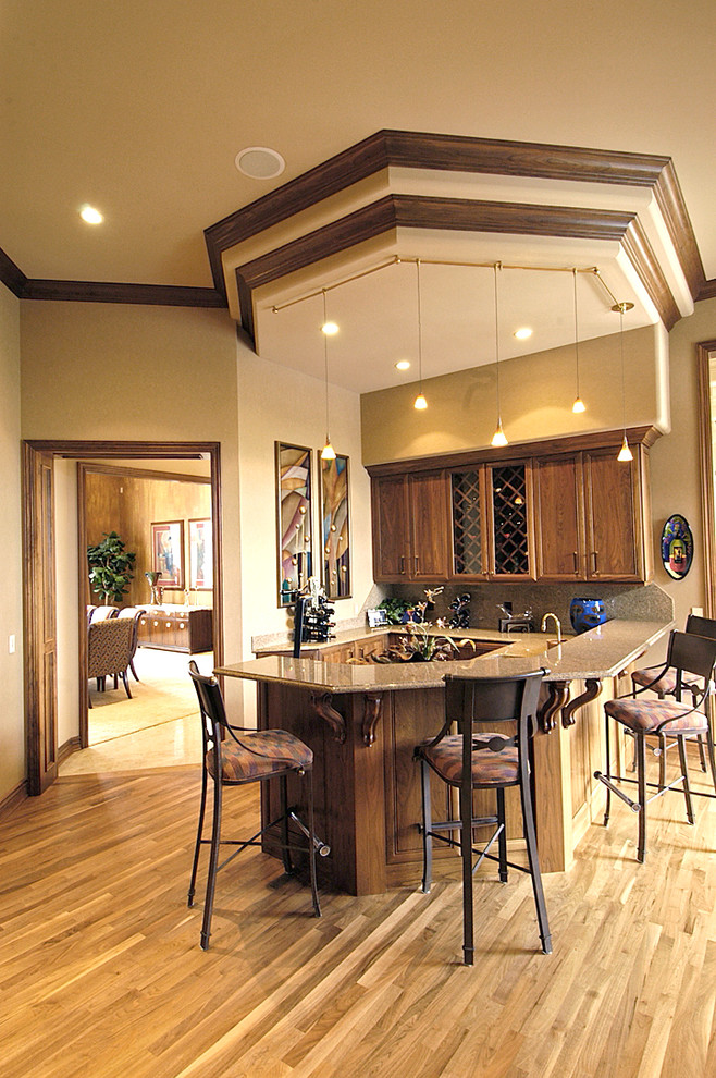 Design ideas for a mid-sized transitional home bar in Omaha.