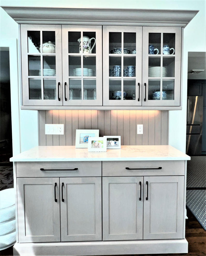 Inspiration for a transitional kitchen remodel in New York with shaker cabinets, blue cabinets and stainless steel appliances