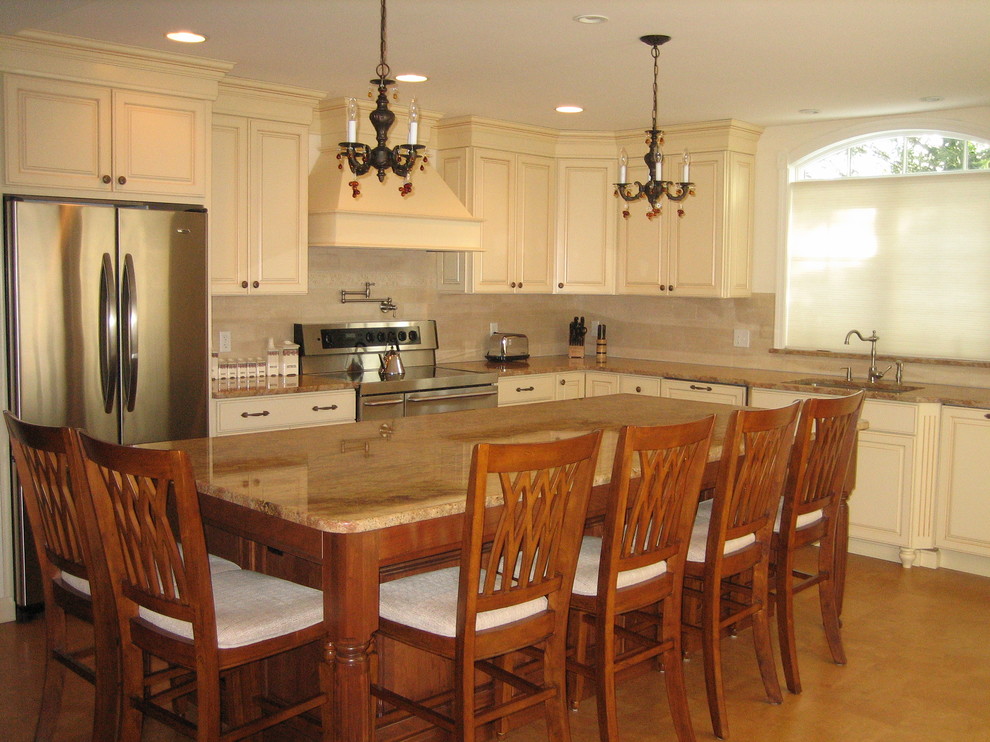 Eat-in kitchen - mid-sized transitional l-shaped cork floor eat-in kitchen idea in Providence with a single-bowl sink, raised-panel cabinets, yellow cabinets, granite countertops, beige backsplash, stone tile backsplash, paneled appliances, blue walls and an island