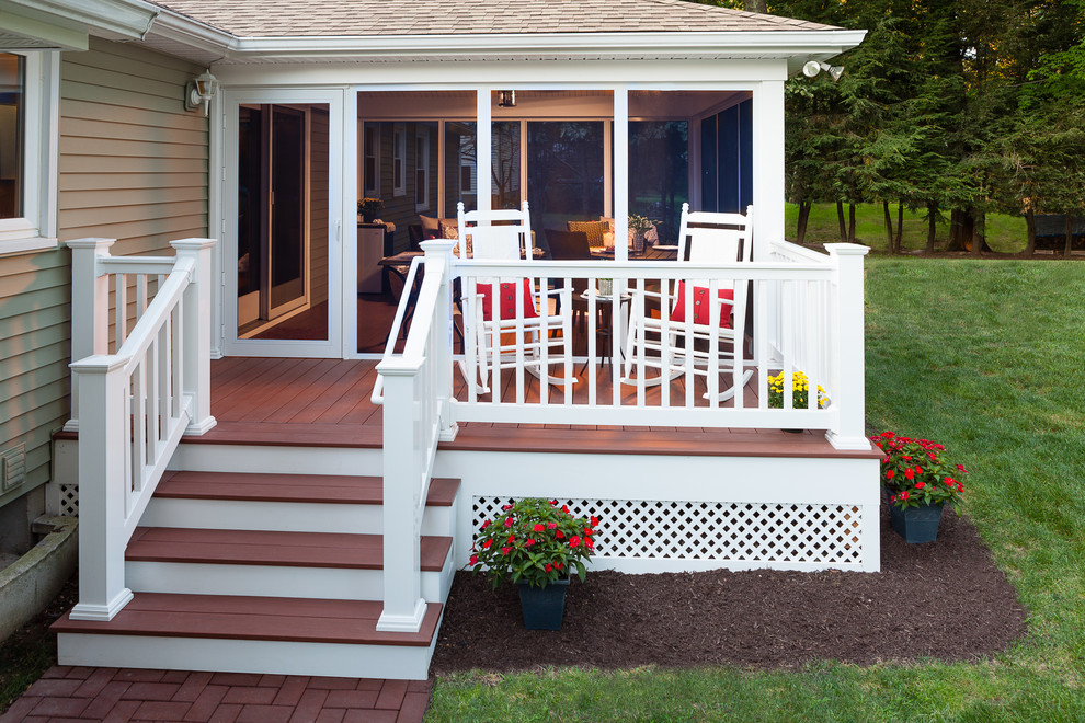 Mid-sized elegant backyard deck photo in Boston with a roof extension