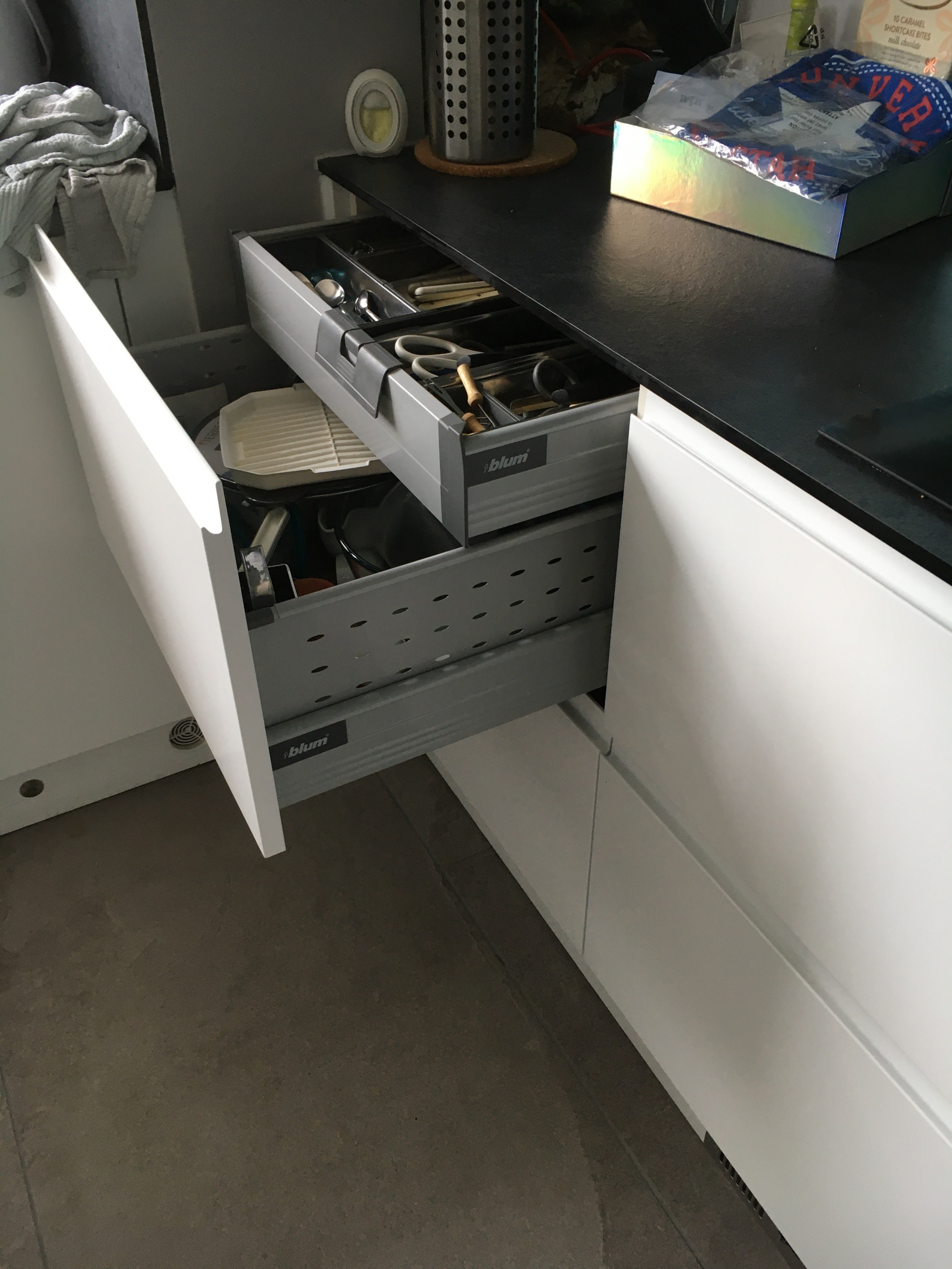 J pull handle Kitchen with compact laminate and porcelain floor tiles
