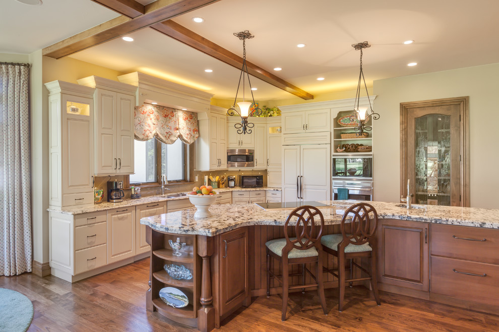 Kitchen - rustic l-shaped medium tone wood floor kitchen idea in Denver with an undermount sink, flat-panel cabinets, white cabinets, granite countertops, beige backsplash, ceramic backsplash, paneled appliances and an island