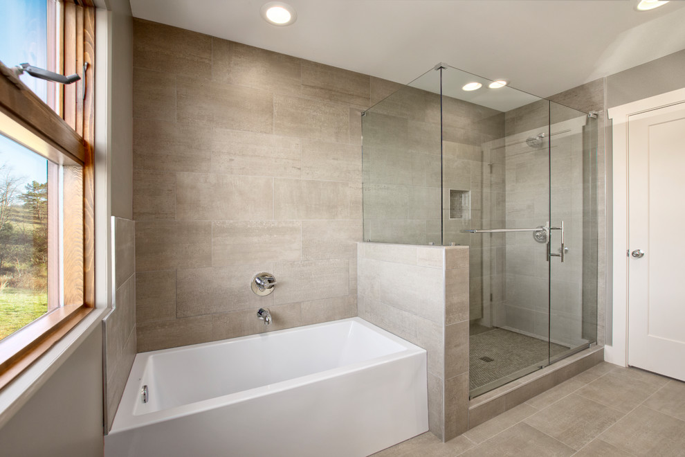 Photo of a mid-sized country kids bathroom in Other with flat-panel cabinets, beige cabinets, an alcove tub, an open shower, gray tile, grey walls, a drop-in sink, granite benchtops, grey floor and a hinged shower door.