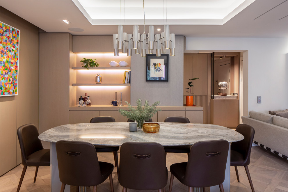 This is an example of a contemporary dining room in Other with white walls, medium hardwood floors, brown floor and recessed.