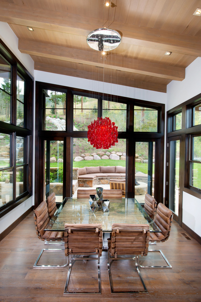 Mid-sized contemporary open plan dining in Denver with white walls, medium hardwood floors and no fireplace.