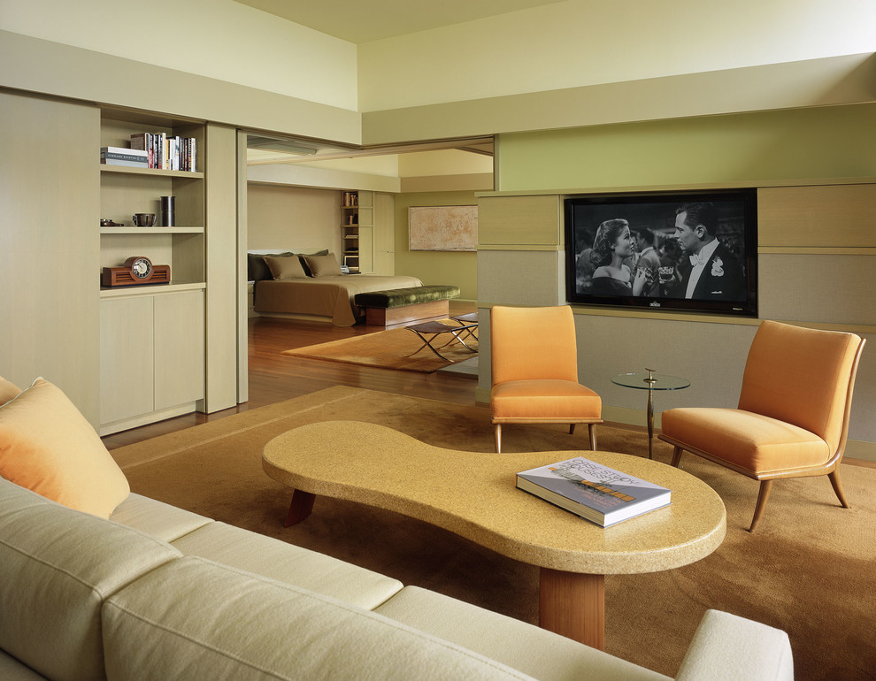 Inspiration for a contemporary family room in Los Angeles with a wall-mounted tv.