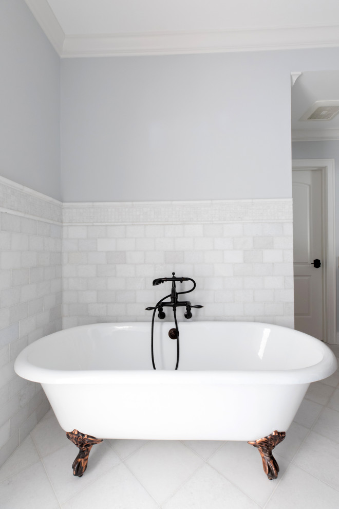 Photo of a mid-sized traditional master bathroom in Milwaukee with flat-panel cabinets, brown cabinets, a claw-foot tub, a corner shower, a two-piece toilet, white tile, stone tile, grey walls, mosaic tile floors, an undermount sink, engineered quartz benchtops, white floor, a hinged shower door, white benchtops, a double vanity and a built-in vanity.