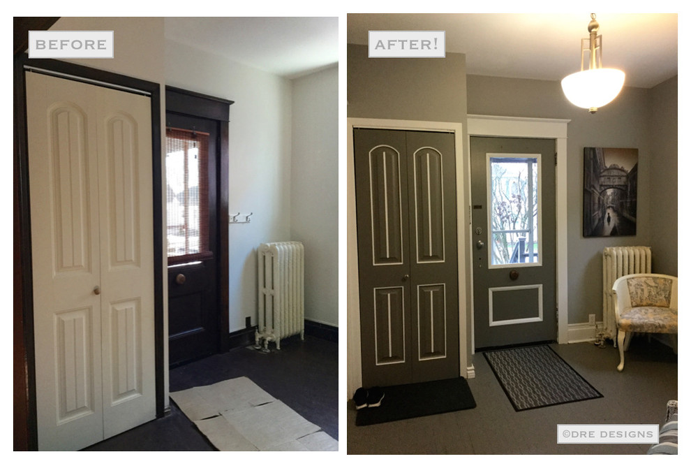Foyer - large transitional painted wood floor foyer idea in Toronto with gray walls and a gray front door
