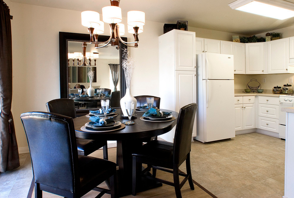 Mid-sized transitional kitchen/dining combo in Other with beige walls and linoleum floors.