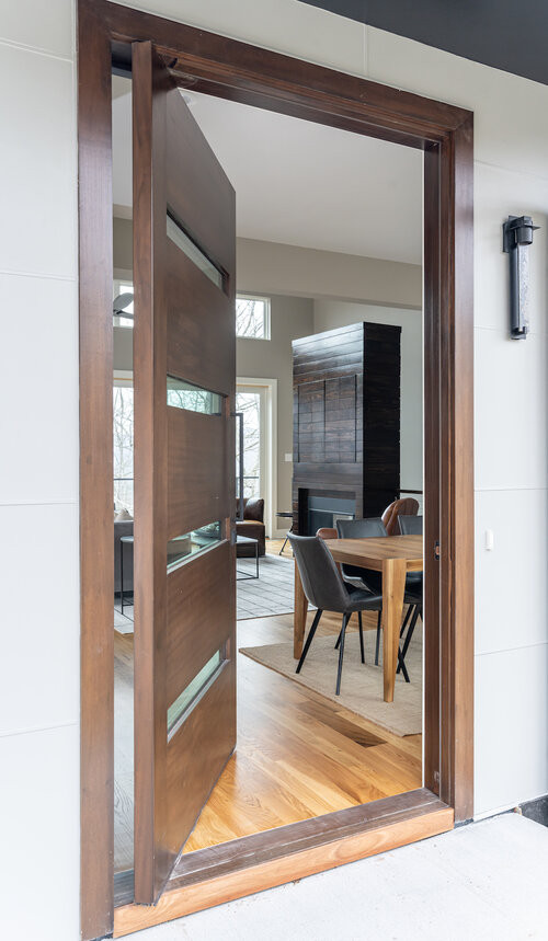 Front door - rustic front door idea with a medium wood front door
