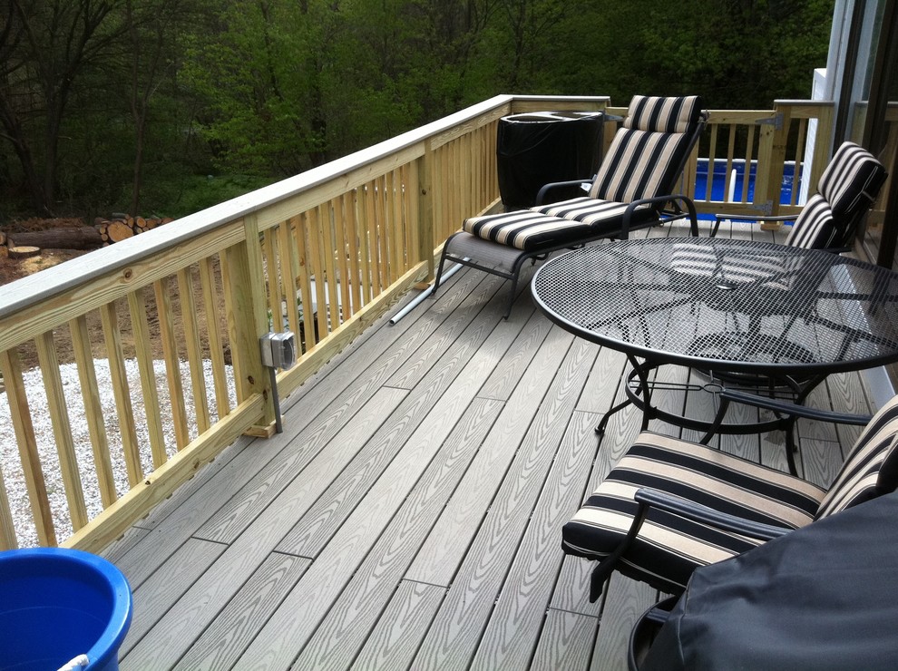 Inspiration for a mid-sized backyard deck remodel in Boston with no cover
