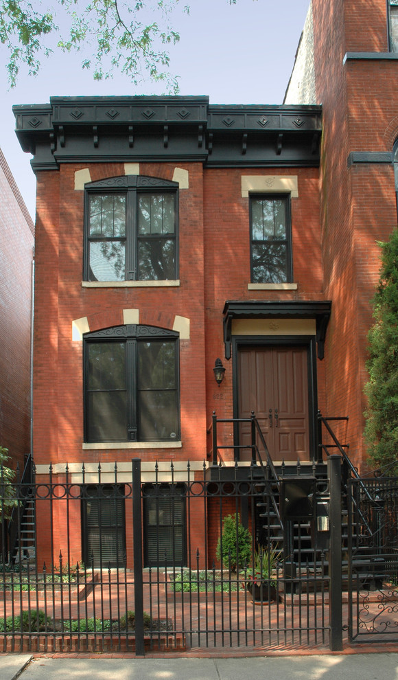 This is an example of a mid-sized traditional three-storey brick exterior in Chicago.