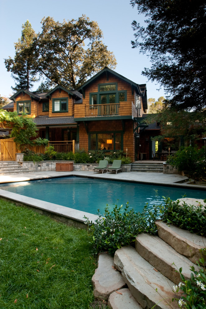 Design ideas for a large country backyard rectangular lap pool in San Francisco with with a pool and concrete pavers.